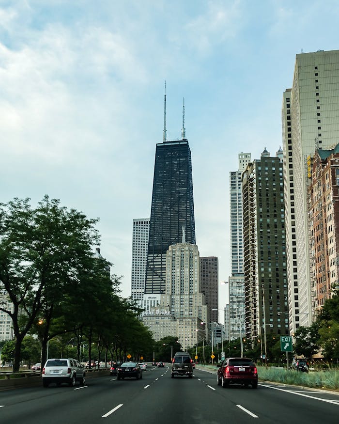 View of Chicago's urban skyline featuring the iconic Hancock Tower on a sunny day.