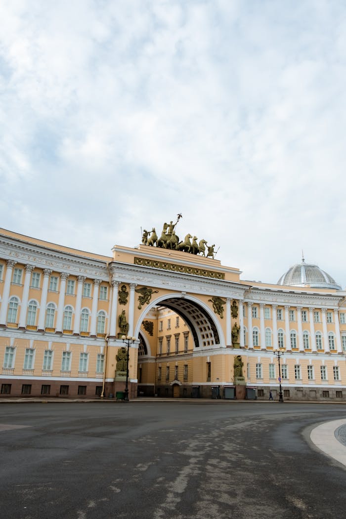 Grand facade of the iconic Triumphal Arch in Saint Petersburg, a historical architectural landmark.